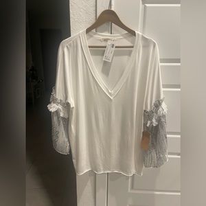 Casual white v neck tee with flower sleeves shirt is light thin material